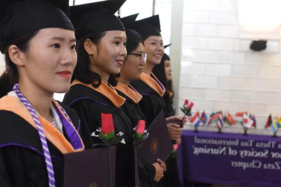 Photo of international students graduating at Chatham University